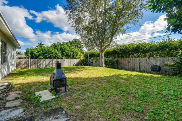 a swimming pool with wooden fence