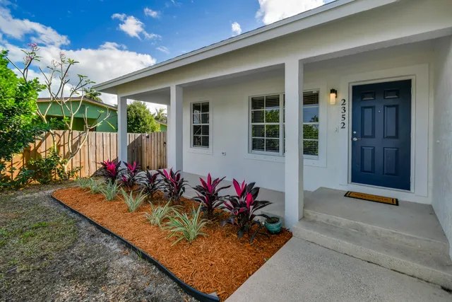 a view of a porch with a potted plant
