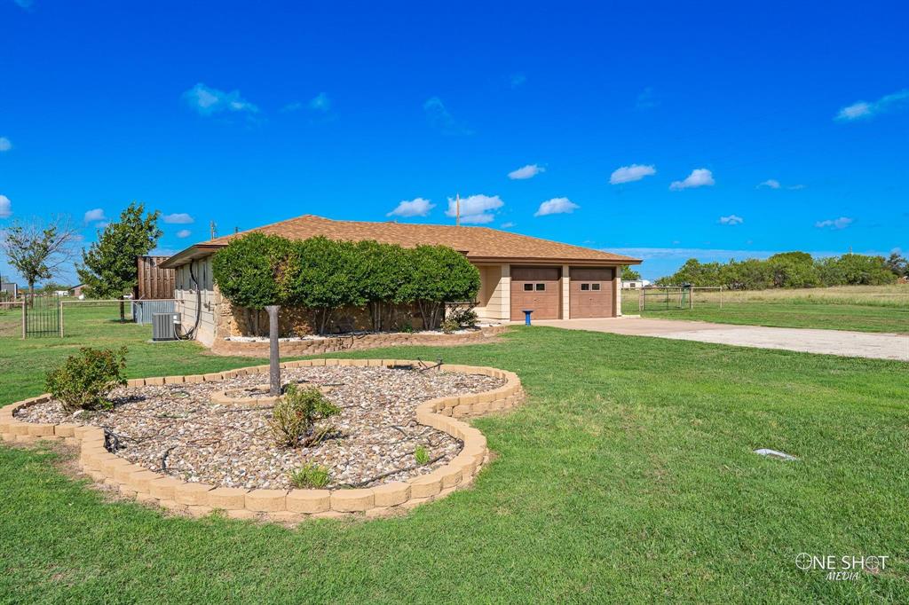 a swimming pool with outdoor seating and yard