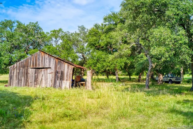 a garden view with swimming pool