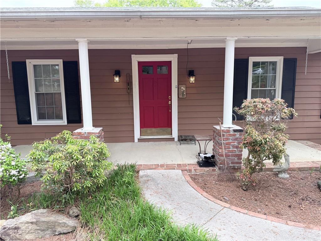 3033 Riviera Drive Conyers, GA 30012 - Photo 4 of 79 a front view of a house with garden