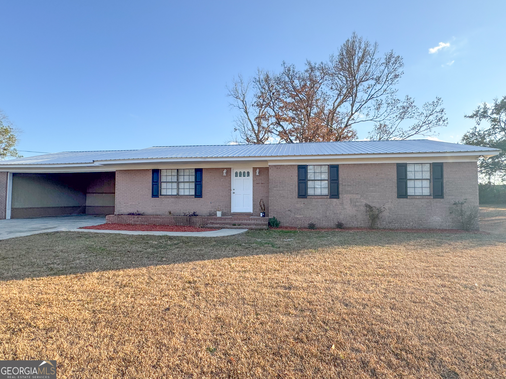 1705 Moses Drive Vidalia, GA 30474 - Photo 17 of 23 front view of a house with a yard