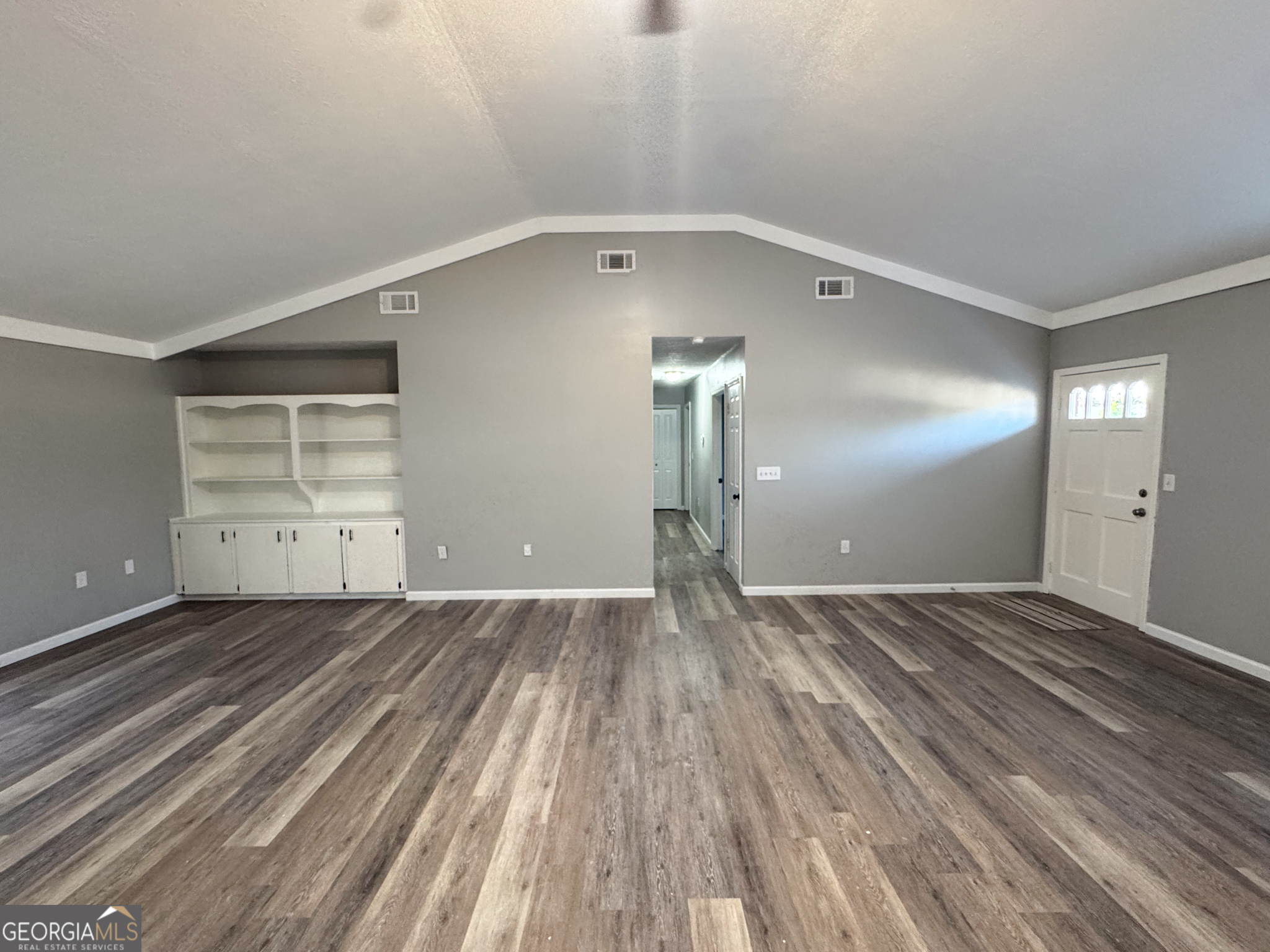 1705 Moses Drive Vidalia, GA 30474 - Photo 2 of 23 a view of empty room with wooden floor