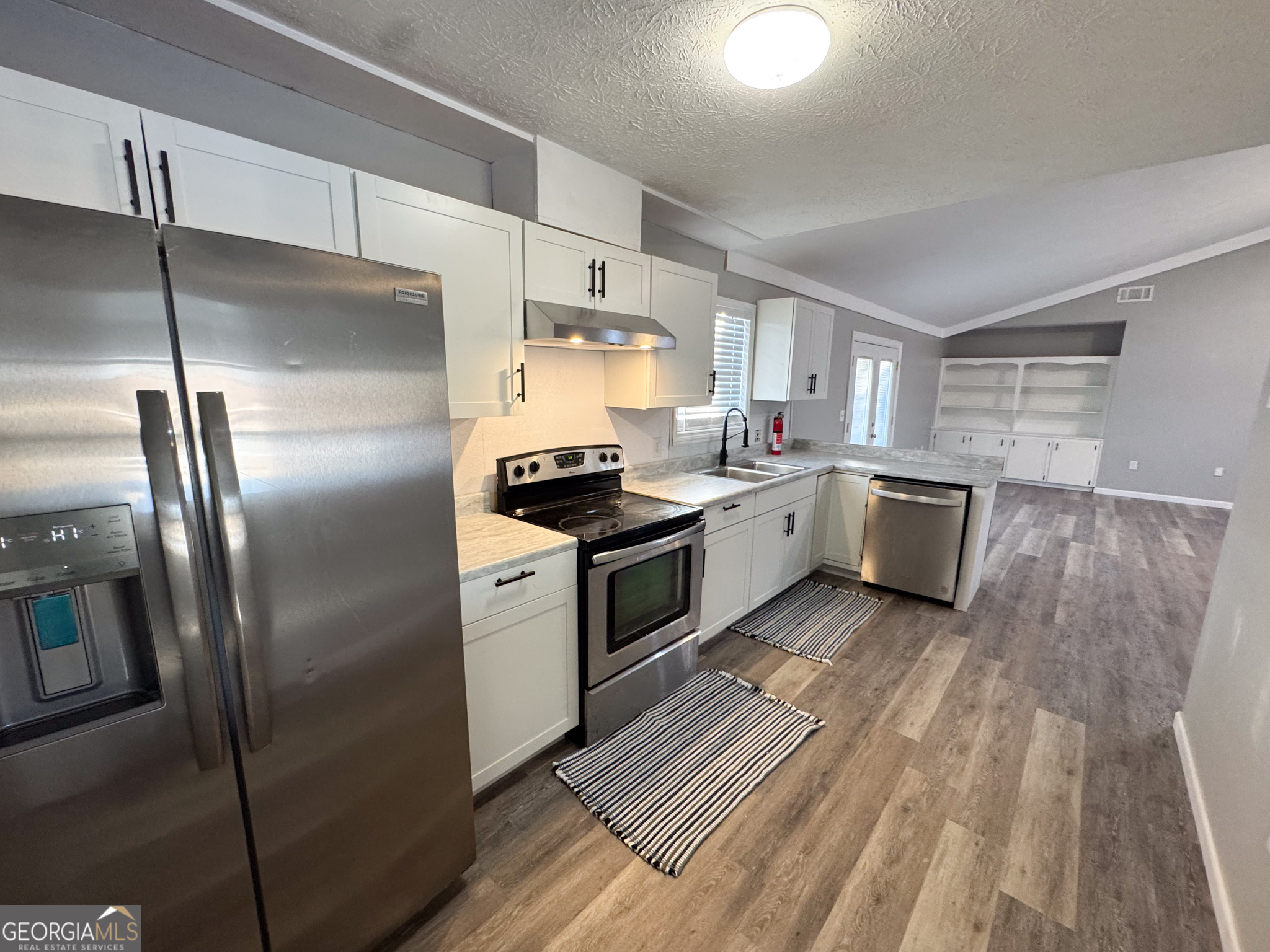 1705 Moses Drive Vidalia, GA 30474 - Photo 6 of 23 a kitchen with a stove a refrigerator and a sink