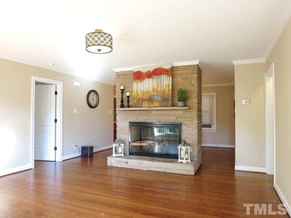 105 Dartmouth Road Raleigh, NC 27609 - Photo 2 of 25 Home features NEW electrical/windows/Kitchen/flooring/Screened Porch! Beautiful hardwood floors & crown molding throughout. Spacious Living Rm has floor-to-ceiling stacked stone gas log FP.