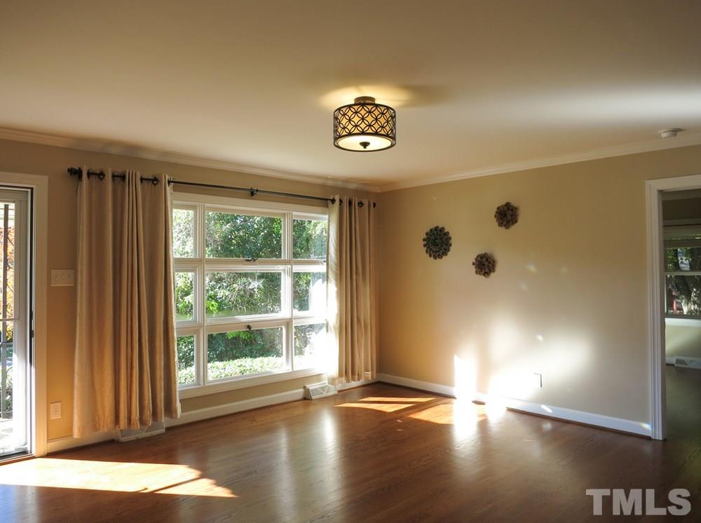 105 Dartmouth Road Raleigh, NC 27609 - Photo 3 of 25 Spacious Living Rm offers a huge window and lots of natural light.