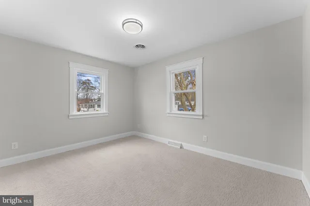 a view of a workspace with furniture