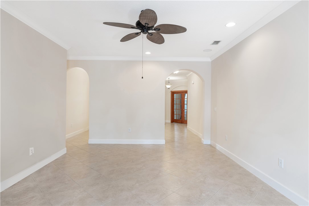 4231 Diamond Square Vero Beach, FL 32967 - Photo 14 of 28 a view of an empty room and a ceiling fan