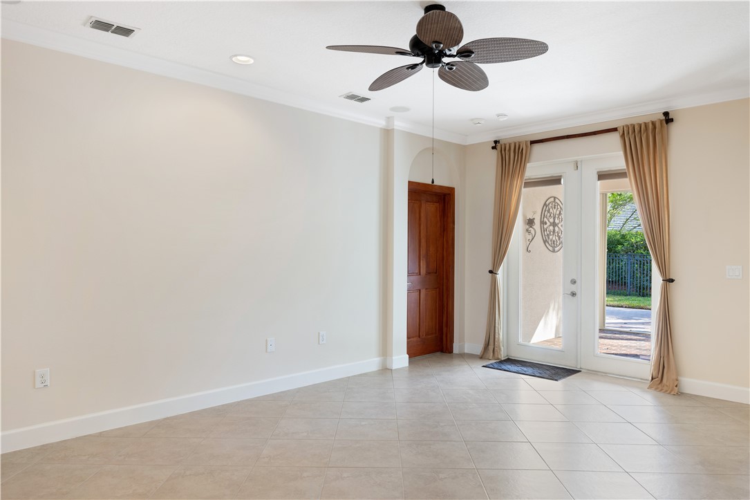 4231 Diamond Square Vero Beach, FL 32967 - Photo 15 of 28 a view of room with a ceiling fan and window