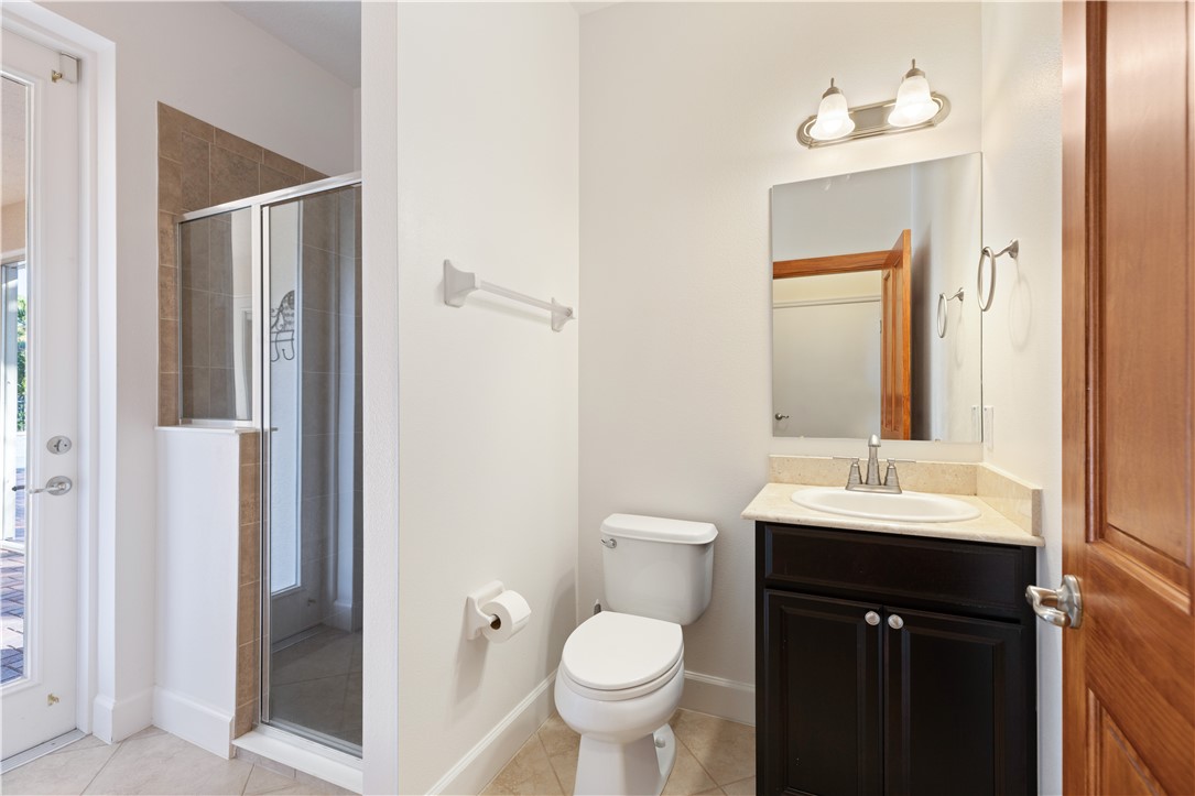 4231 Diamond Square Vero Beach, FL 32967 - Photo 23 of 28 a bathroom with a toilet sink and mirror
