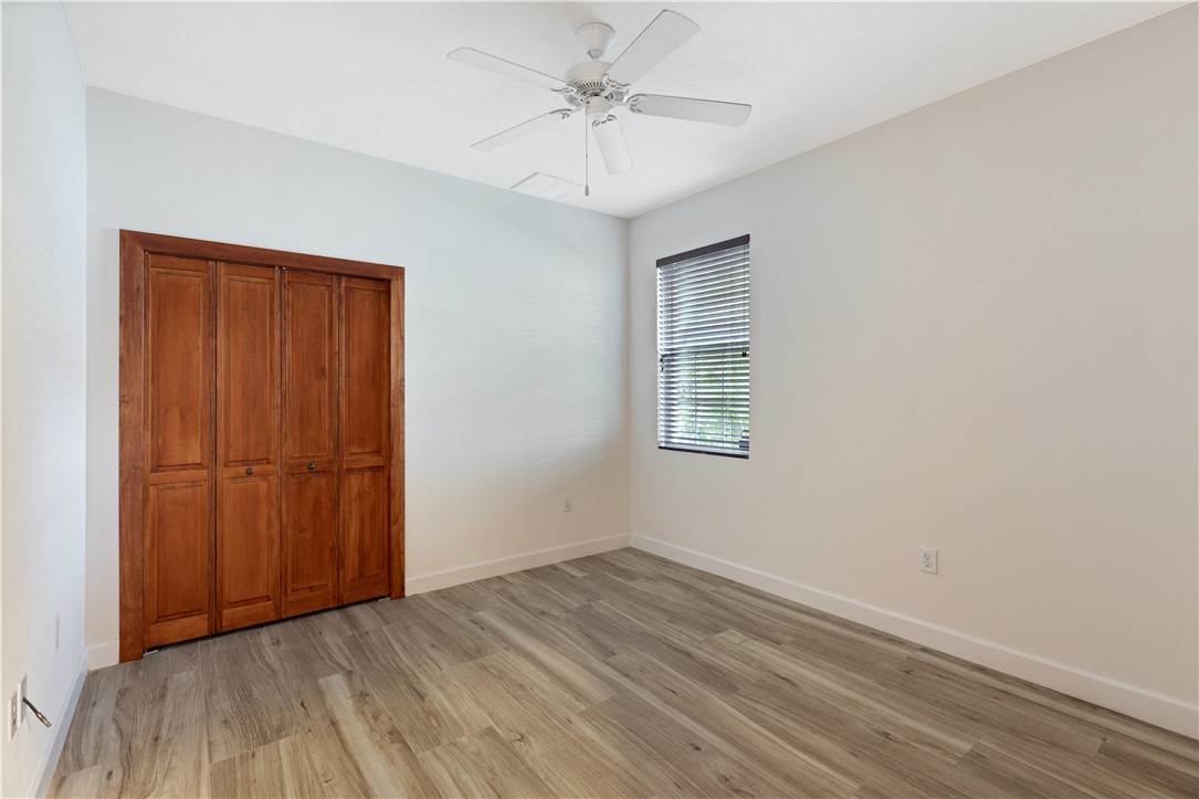 4231 Diamond Square Vero Beach, FL 32967 - Photo 24 of 28 an empty room with a window and a ceiling fan
