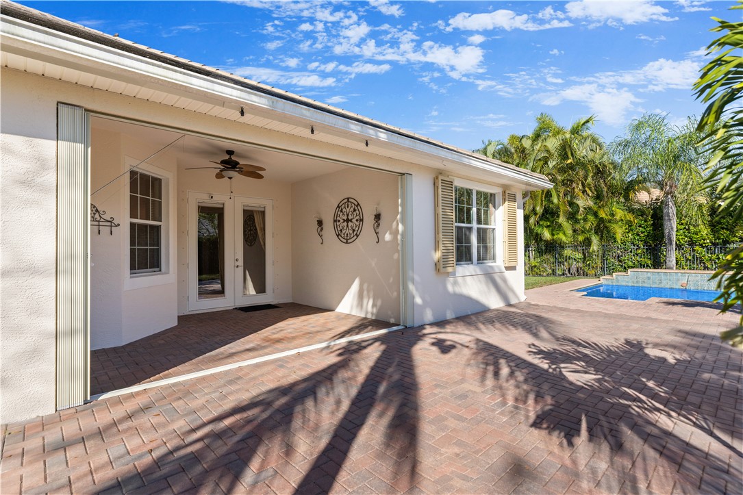 4231 Diamond Square Vero Beach, FL 32967 - Photo 26 of 28 a view of a house with backyard and sitting area