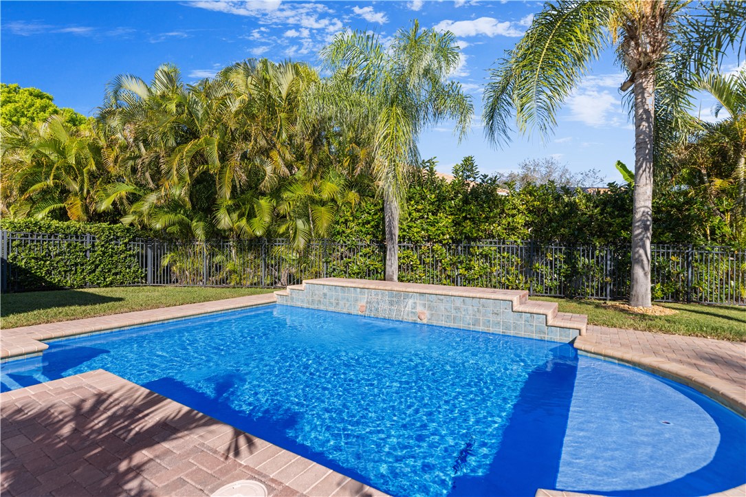 4231 Diamond Square Vero Beach, FL 32967 - Photo 27 of 28 a view of a swimming pool with an outdoor space and seating area