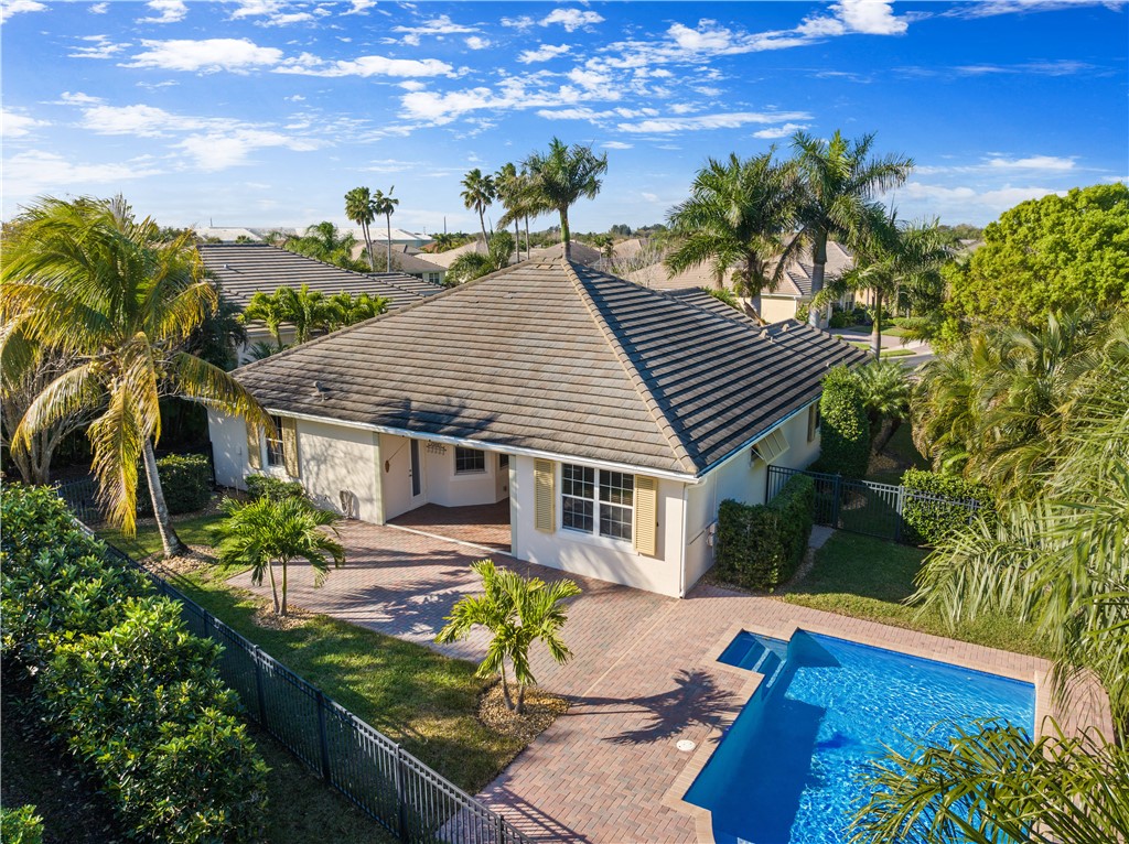 4231 Diamond Square Vero Beach, FL 32967 - Photo 3 of 28 a view of a house with backyard and sitting area