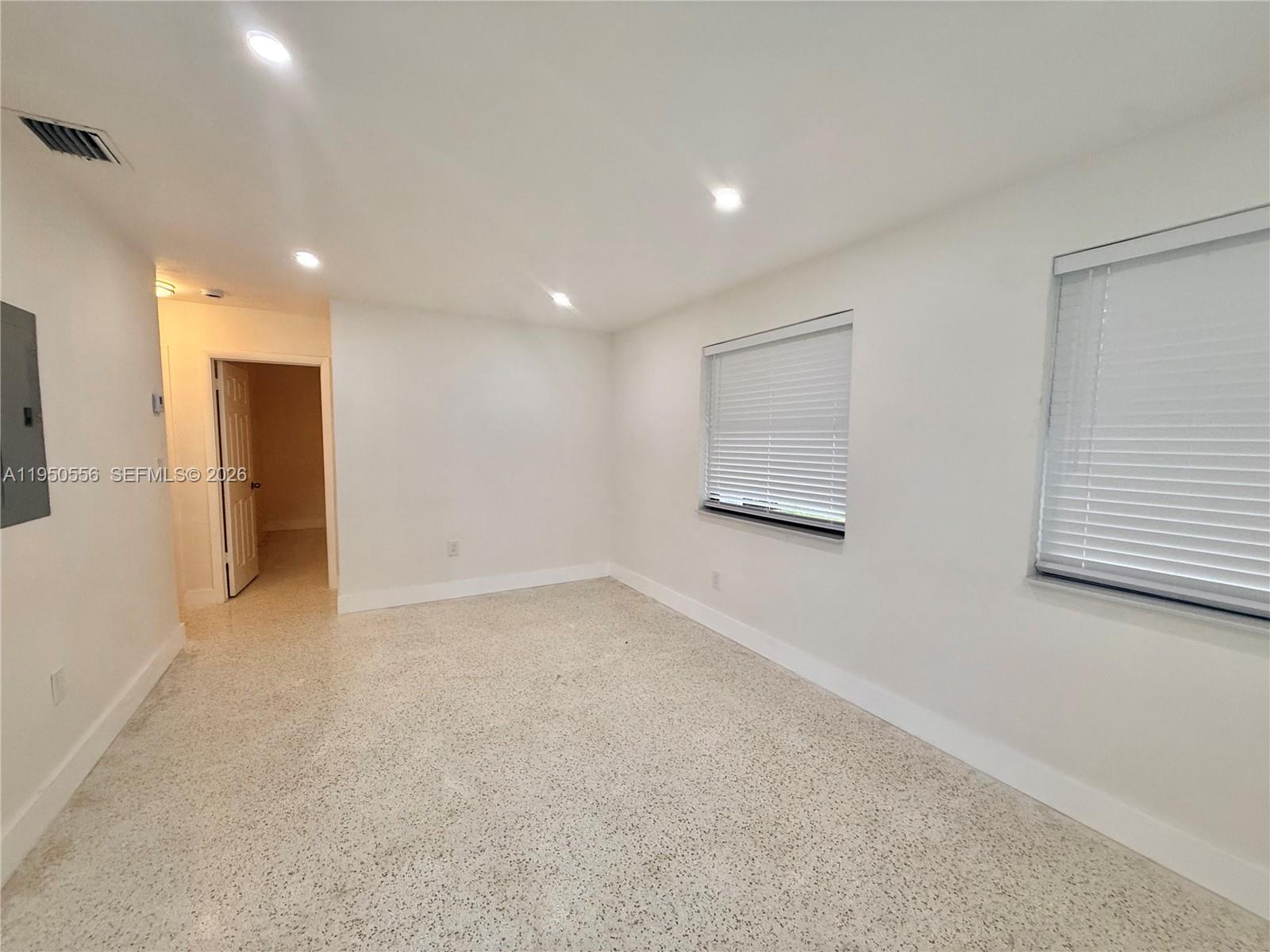 3400 Southwest 17th Street, Unit 1 Miami, FL 33145 - Photo 4 of 10 a view of an empty room with a window