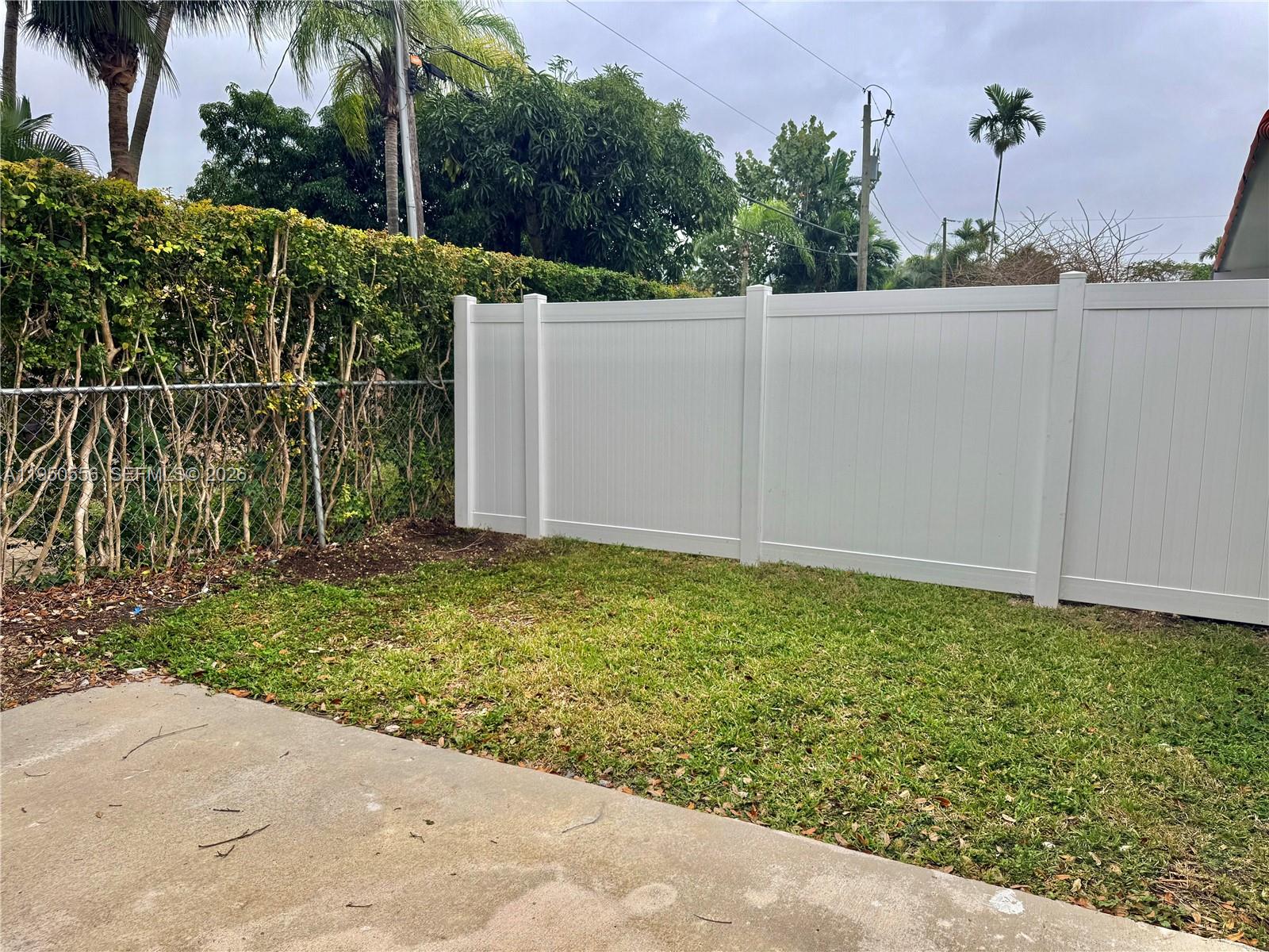3400 Southwest 17th Street, Unit 1 Miami, FL 33145 - Photo 9 of 10 a backyard of a house with lots of green space