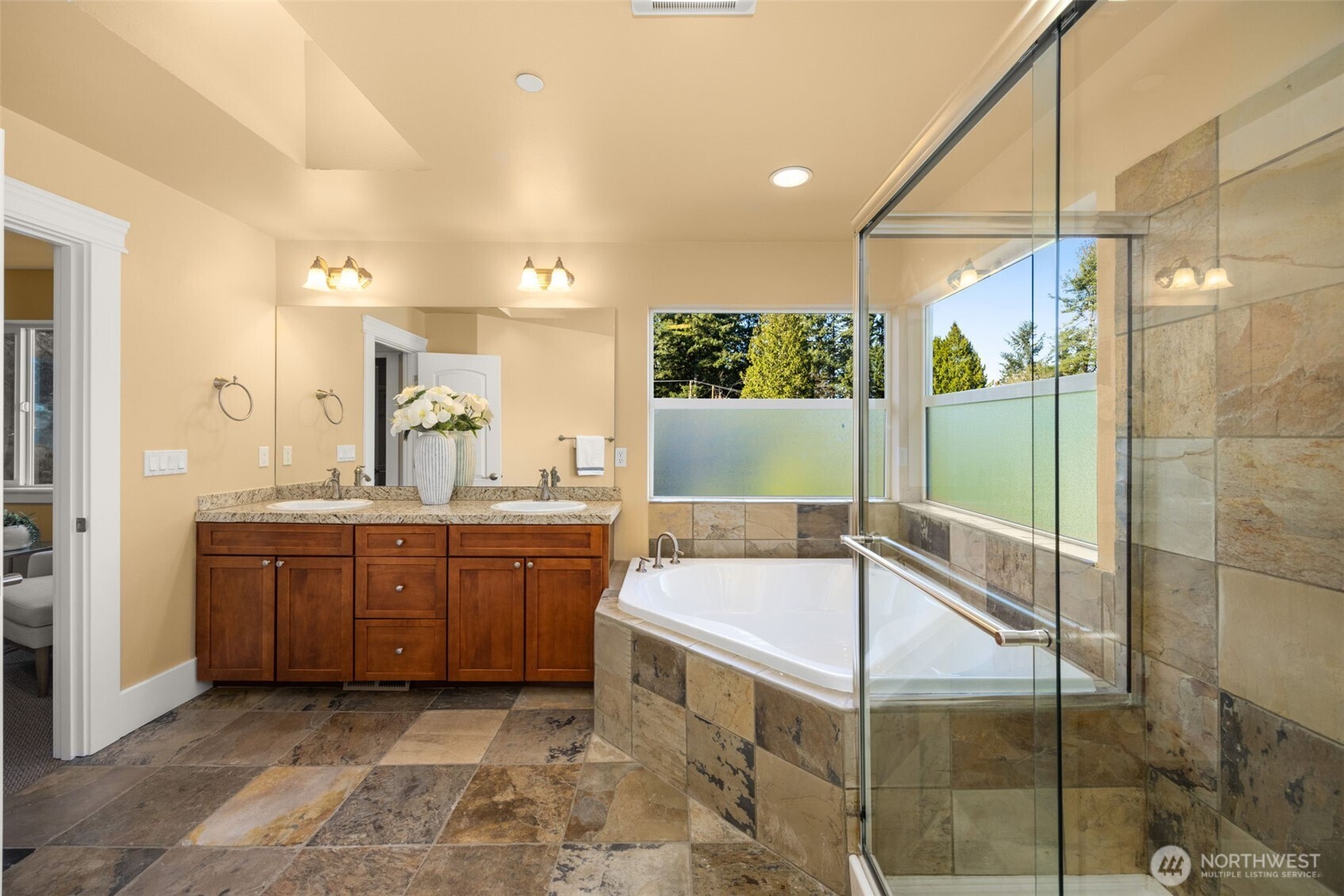 18638 92nd Avenue Northeast Bothell, WA 98011 - Photo 26 of 40 a bathroom with a tub sink and mirror