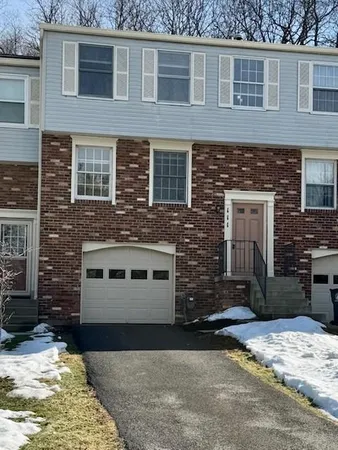 a front view of a house with yard