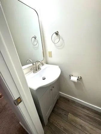 a bathroom with a sink and mirror