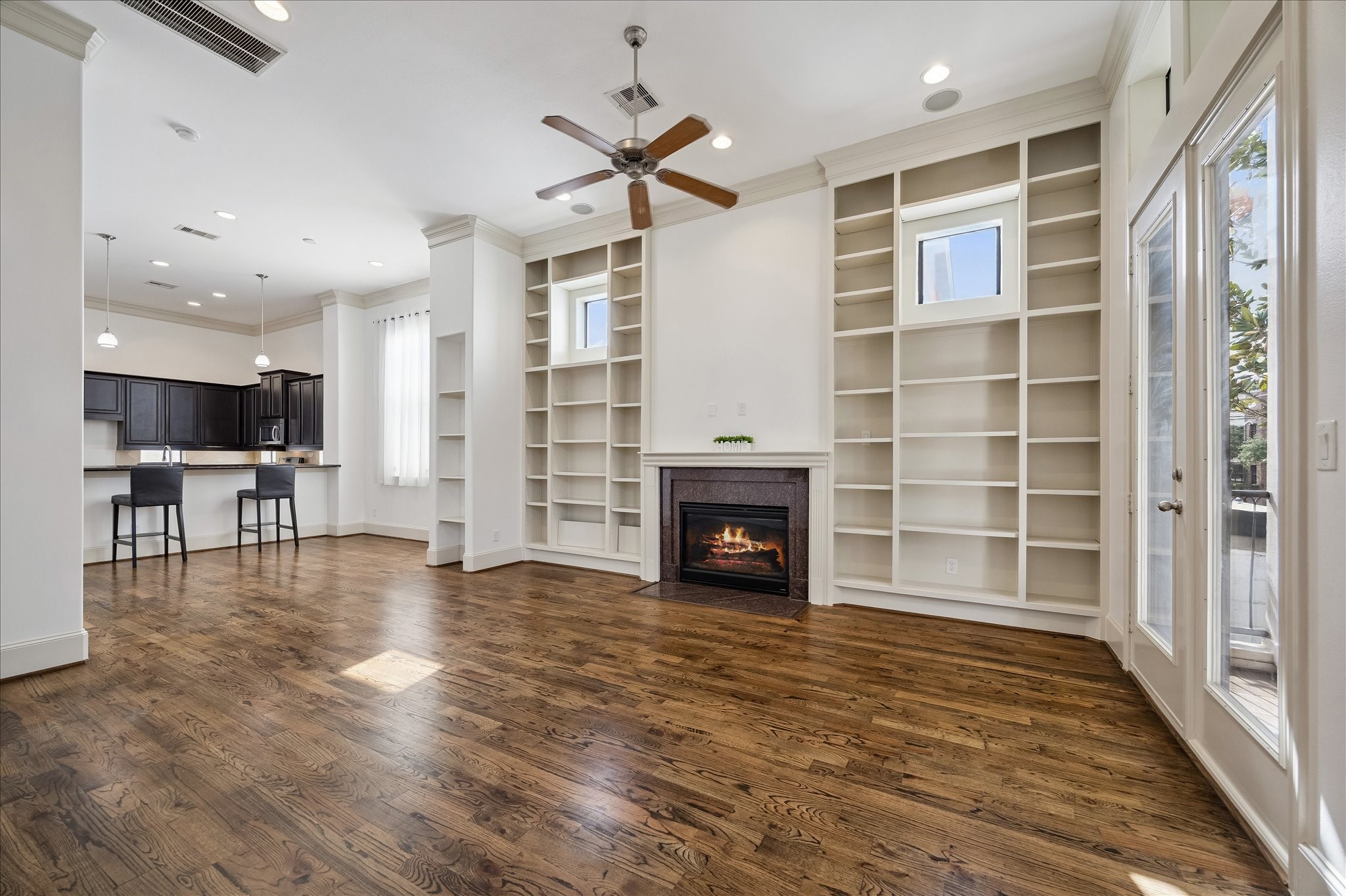 1407 Shearn Street Houston, TX 77007 - Photo 18 of 35 Living room, features wall of built-ins and gas fireplace.