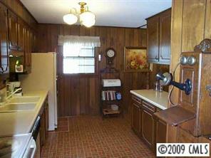 4220 Lake Shore Road South Denver, NC 28037 - Photo 4 of 8 a kitchen with sink cabinets and window