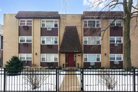 a front view of a building with glass windows