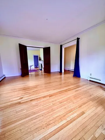 a bedroom with bed and window