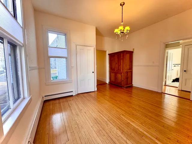 a kitchen with granite countertop white cabinets and sink