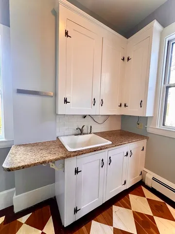 a kitchen with granite countertop a sink and a window