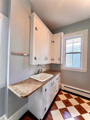 a kitchen with a stove and a refrigerator
