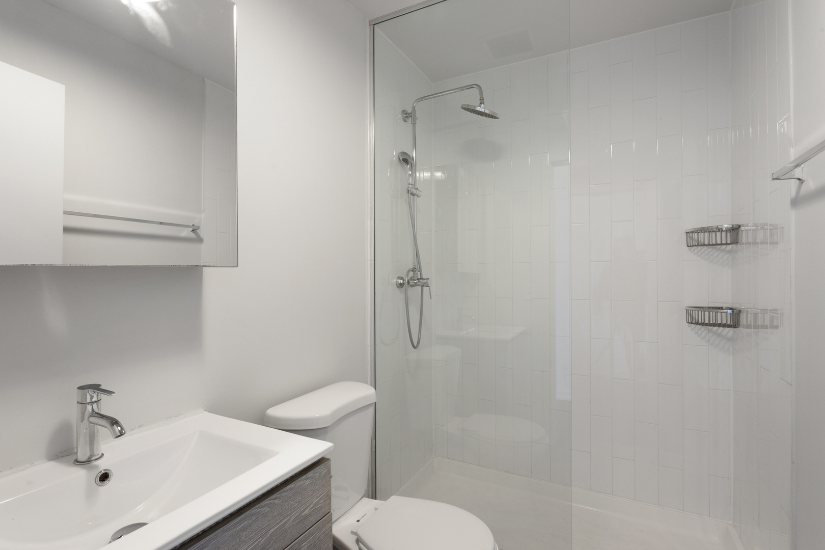 1325 West Wilson Avenue, Unit 605 Chicago, IL 60640 - Photo 8 of 20 a bathroom with a sink toilet and shower