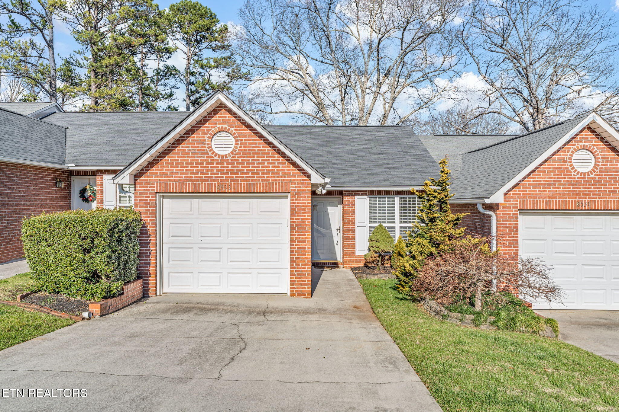 front view of a house with a yard