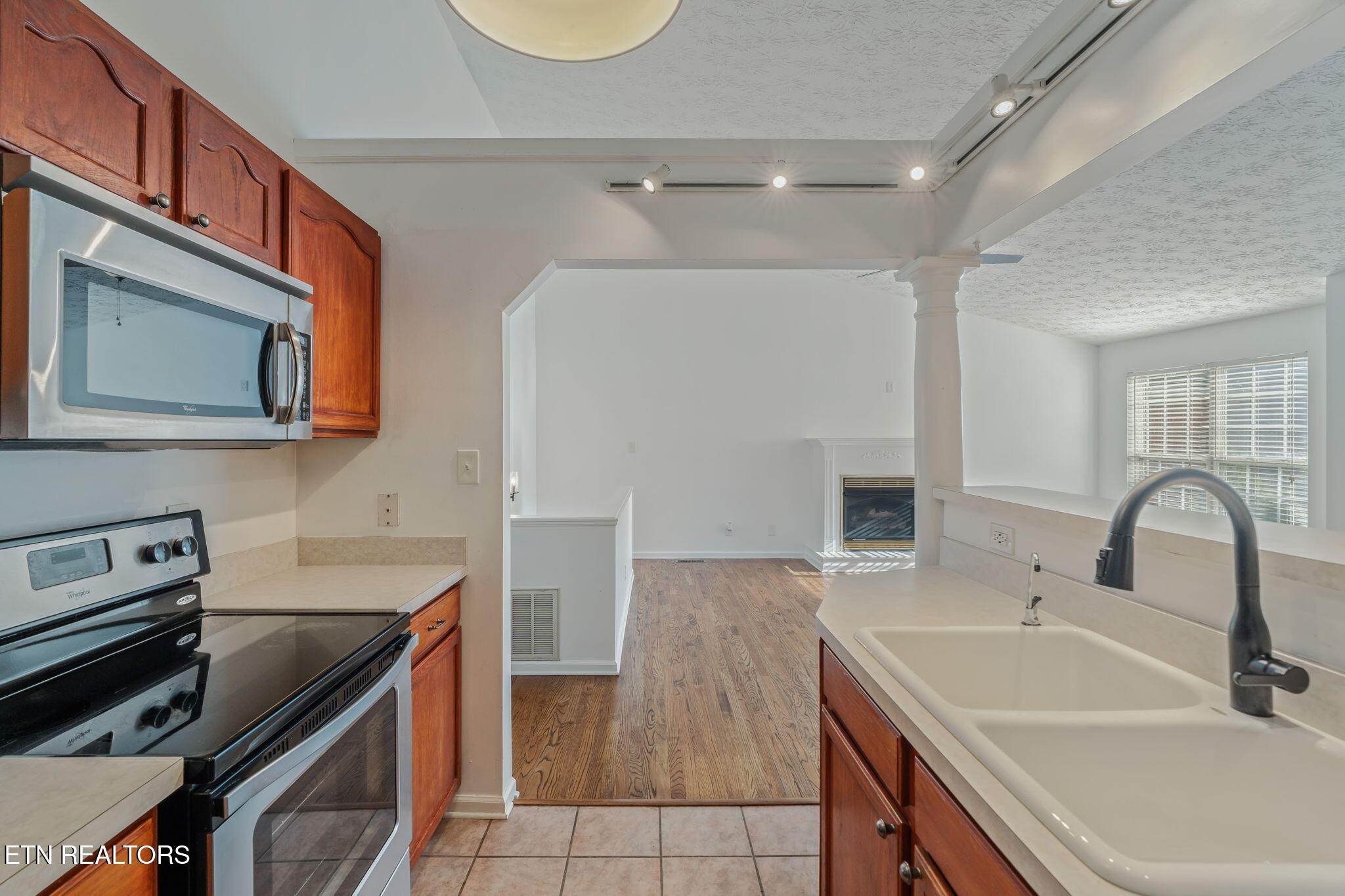 8533 Constance Way Knoxville, TN 37923 - Photo 11 of 30 a kitchen with a sink cabinets and stainless steel appliances