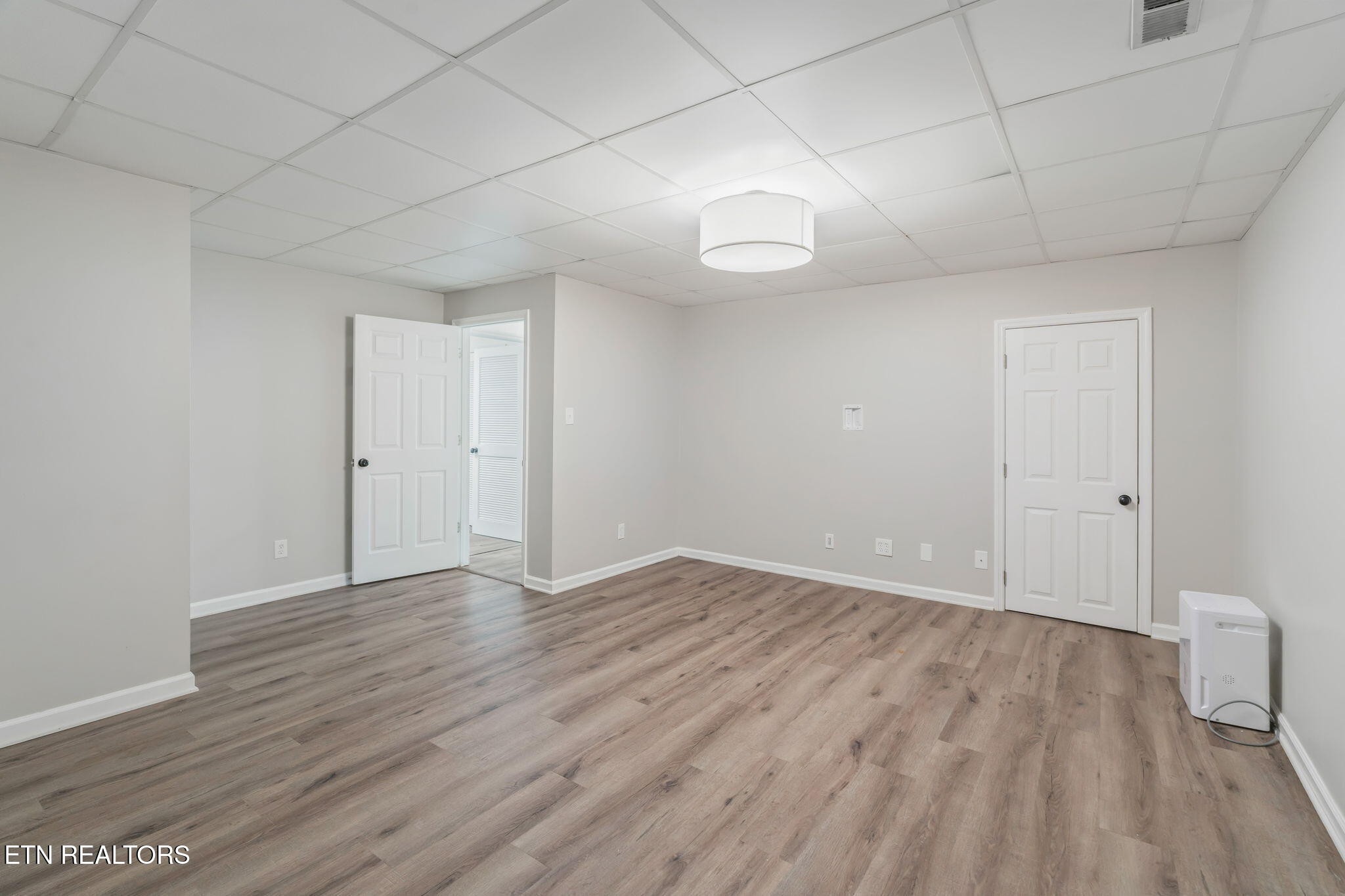 8533 Constance Way Knoxville, TN 37923 - Photo 19 of 30 a view of an empty room with wooden floor