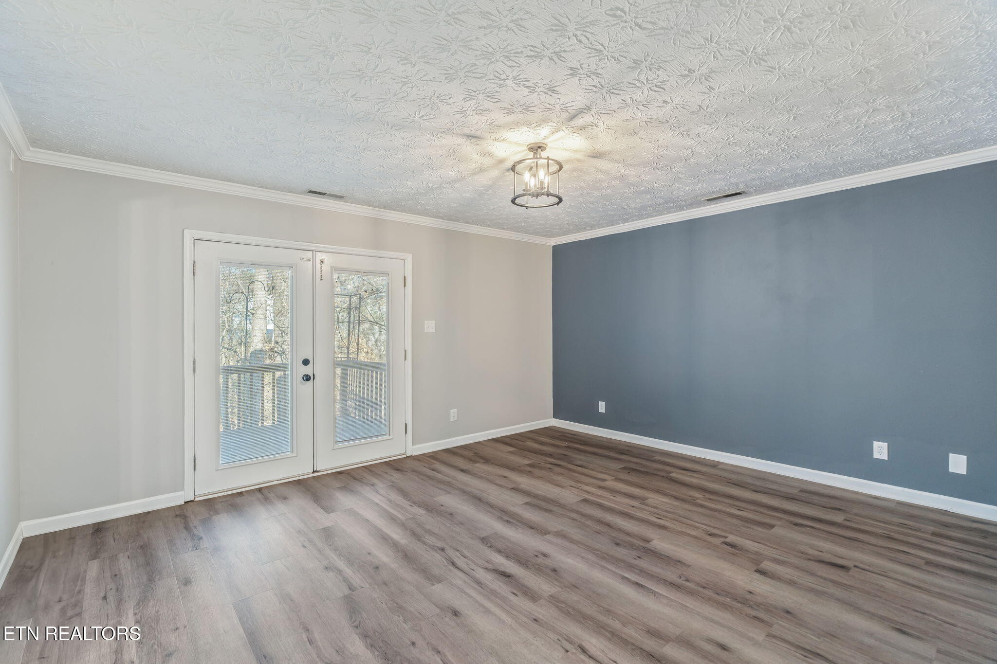8533 Constance Way Knoxville, TN 37923 - Photo 22 of 30 a view of an empty room with wooden floor