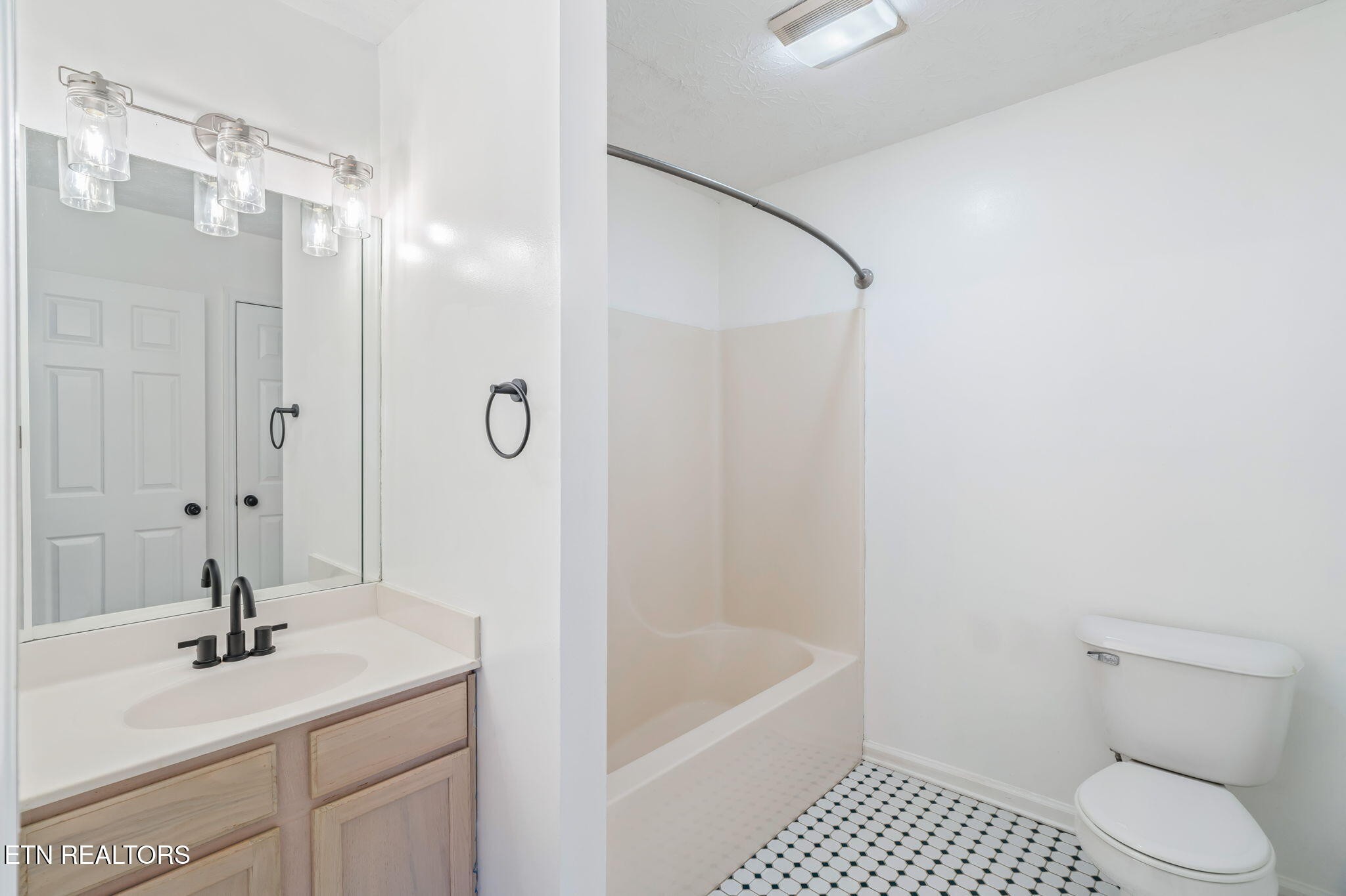 8533 Constance Way Knoxville, TN 37923 - Photo 24 of 30 a bathroom with a sink a toilet and shower