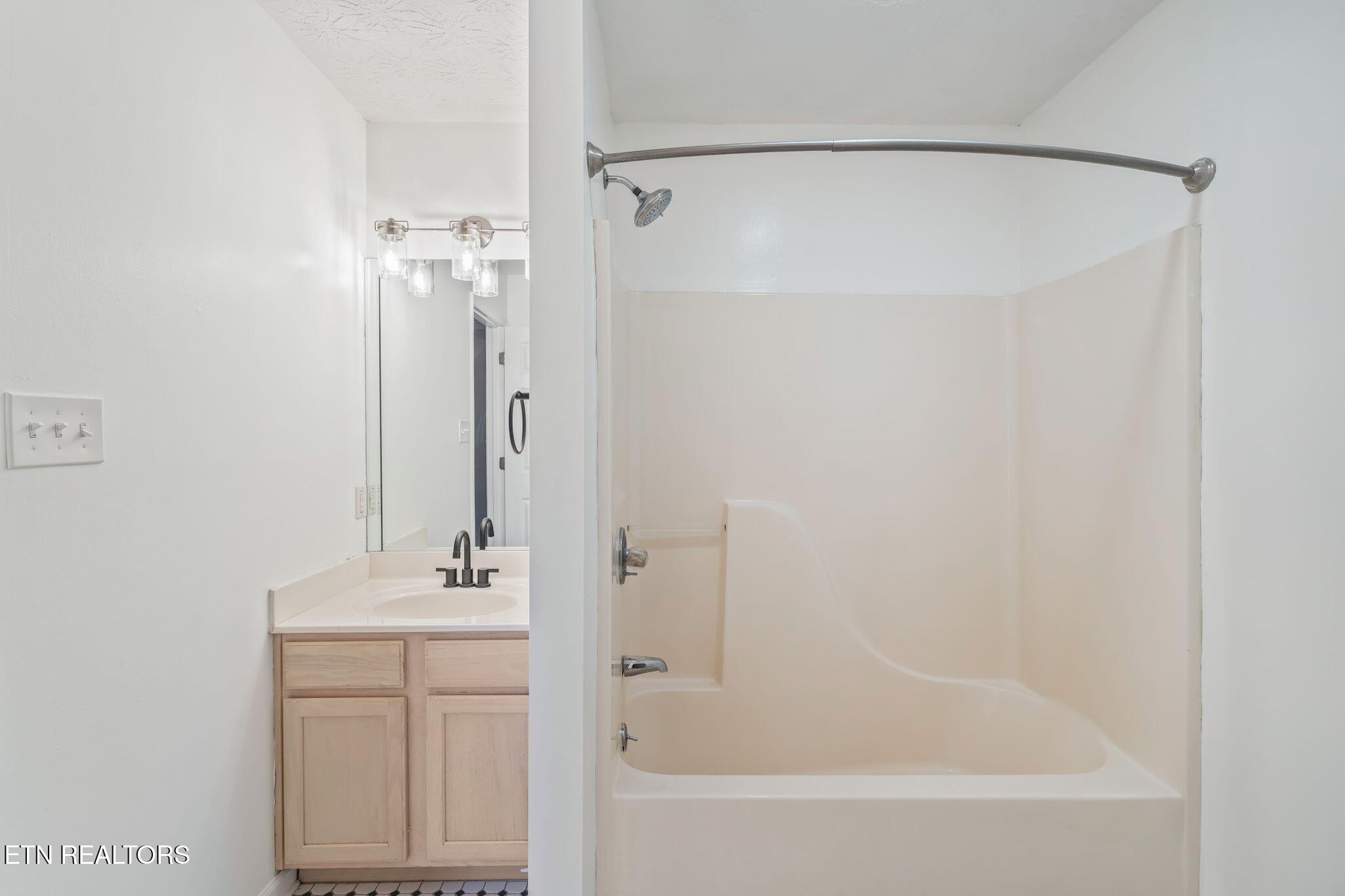 8533 Constance Way Knoxville, TN 37923 - Photo 25 of 30 a bathroom with a bathtub and a sink