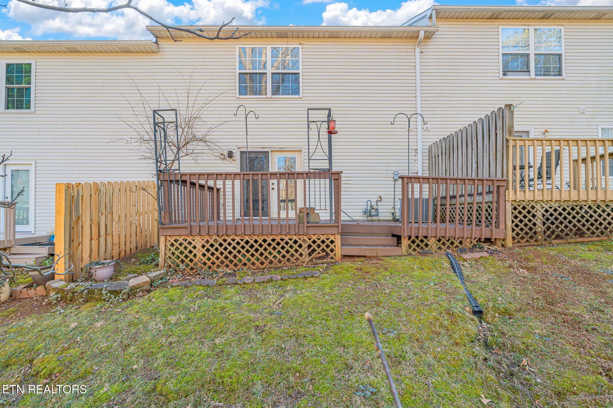 8533 Constance Way Knoxville, TN 37923 - Photo 29 of 30 a view of a deck with a chair under an umbrella