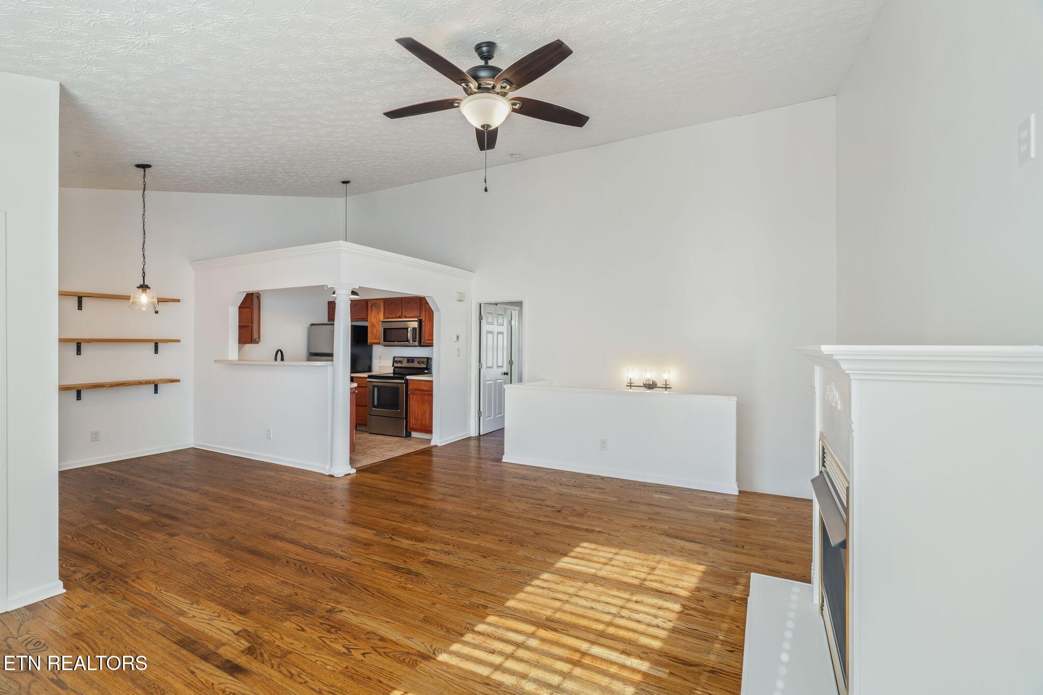 8533 Constance Way Knoxville, TN 37923 - Photo 5 of 30 a view of a kitchen with wooden cabinet and a ceiling fan