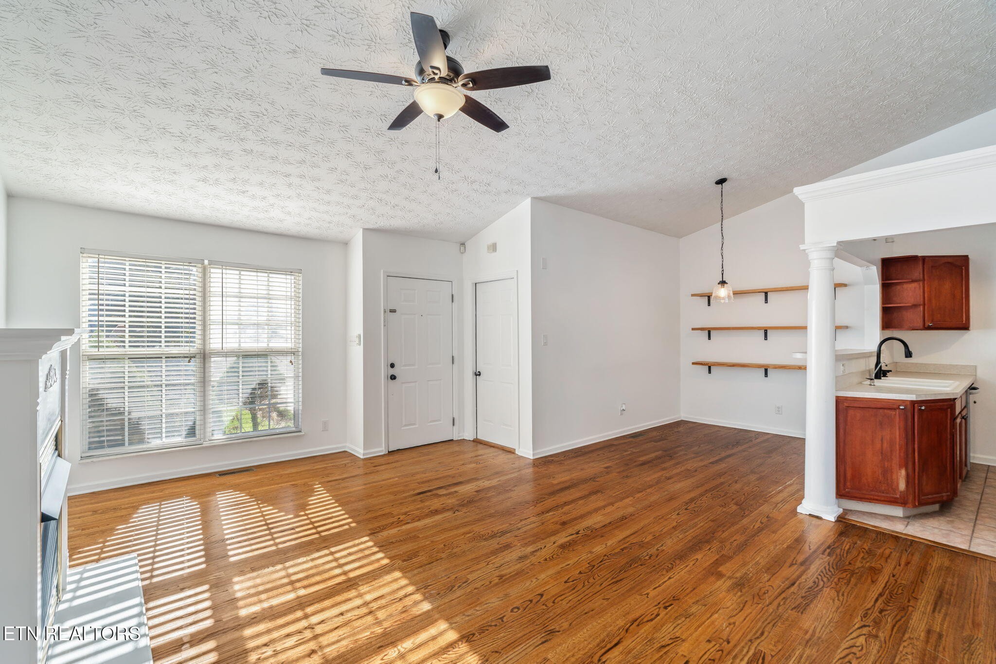 8533 Constance Way Knoxville, TN 37923 - Photo 7 of 30 a view of a kitchen with wooden floor and a window