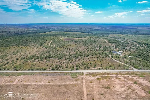 a view of beach with wooden floor