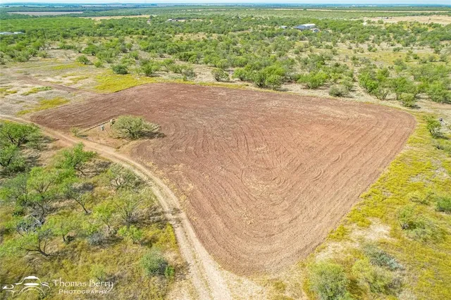 a view of a field with an outdoor space