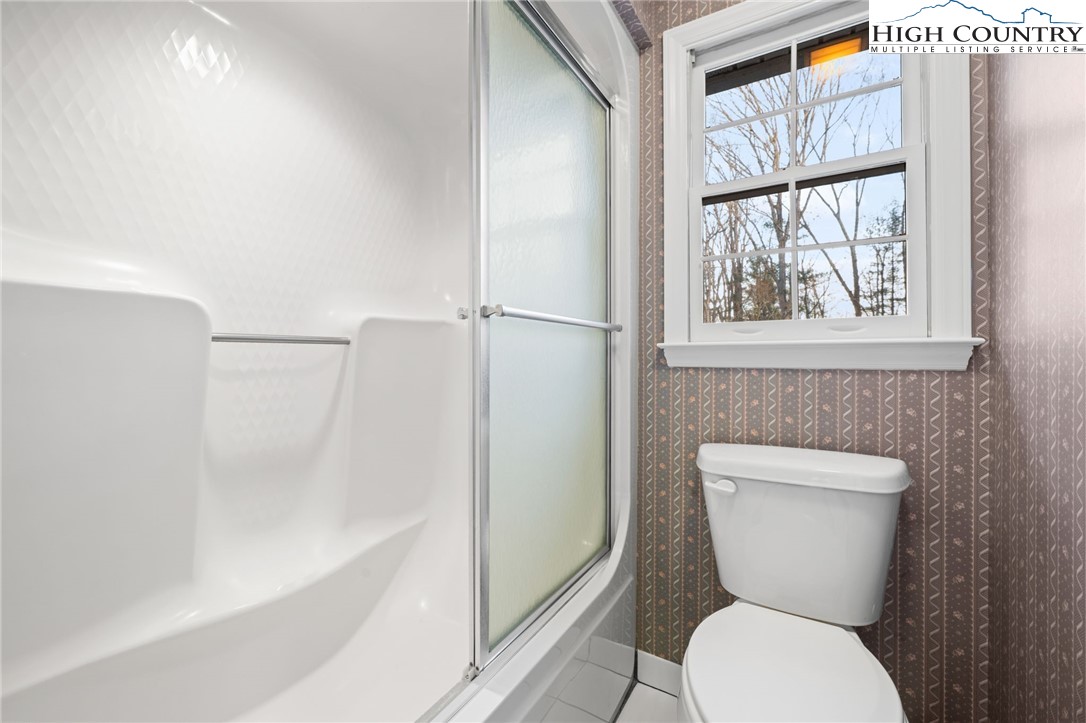458 Jim Caudill Road Wilkesboro, NC 28697 - Photo 30 of 50 a bathroom with a toilet and a shower
