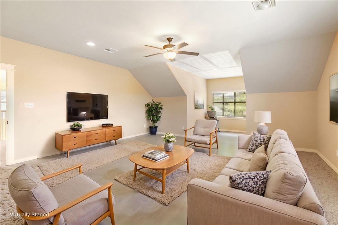 2136 Rockcliffe Loop College Station, TX 77845 - Photo 5 of 48 a living room with furniture and a flat screen tv