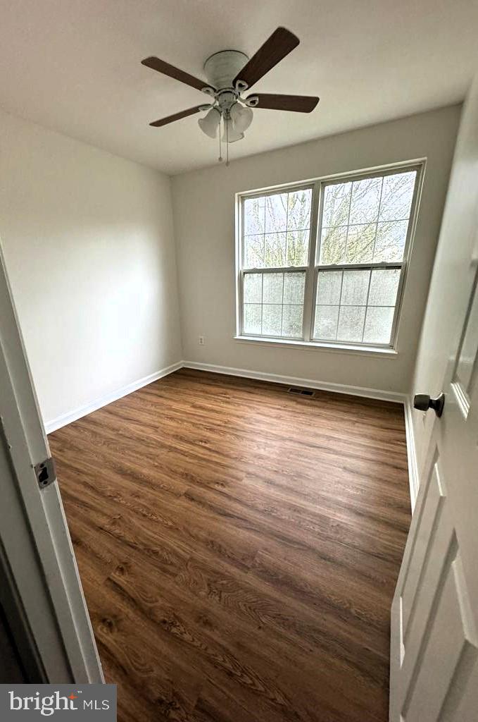 7520 Maury Road Baltimore, MD 21244 - Photo 11 of 29 a view of empty room with wooden floor and fan