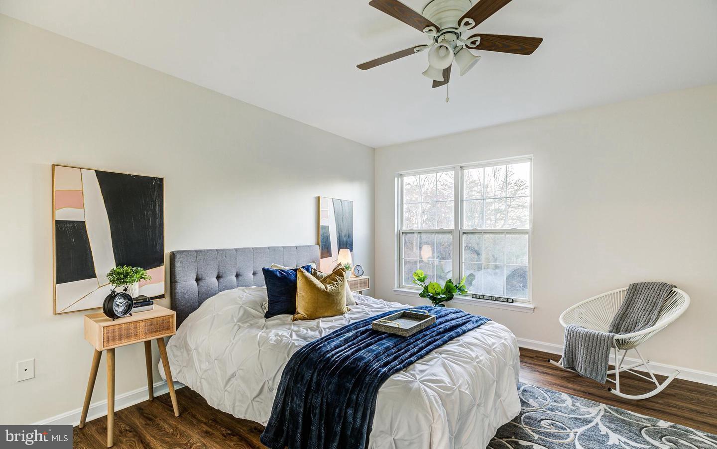 7520 Maury Road Baltimore, MD 21244 - Photo 15 of 29 a bedroom with a bed a window and potted plant