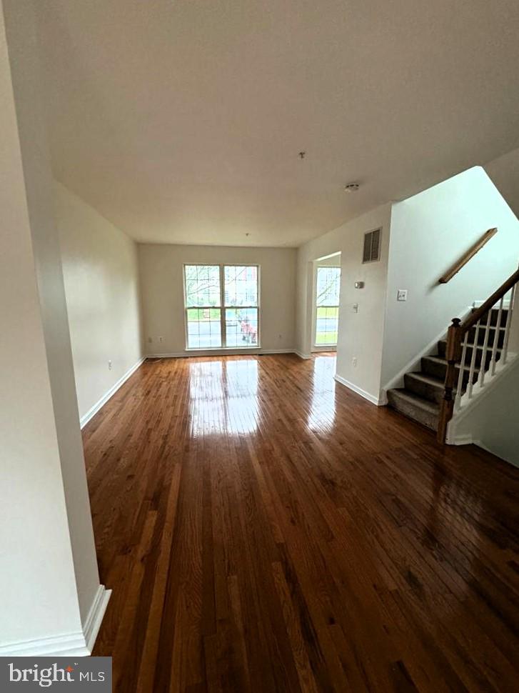 7520 Maury Road Baltimore, MD 21244 - Photo 20 of 29 a view of an empty room with wooden floor and a window