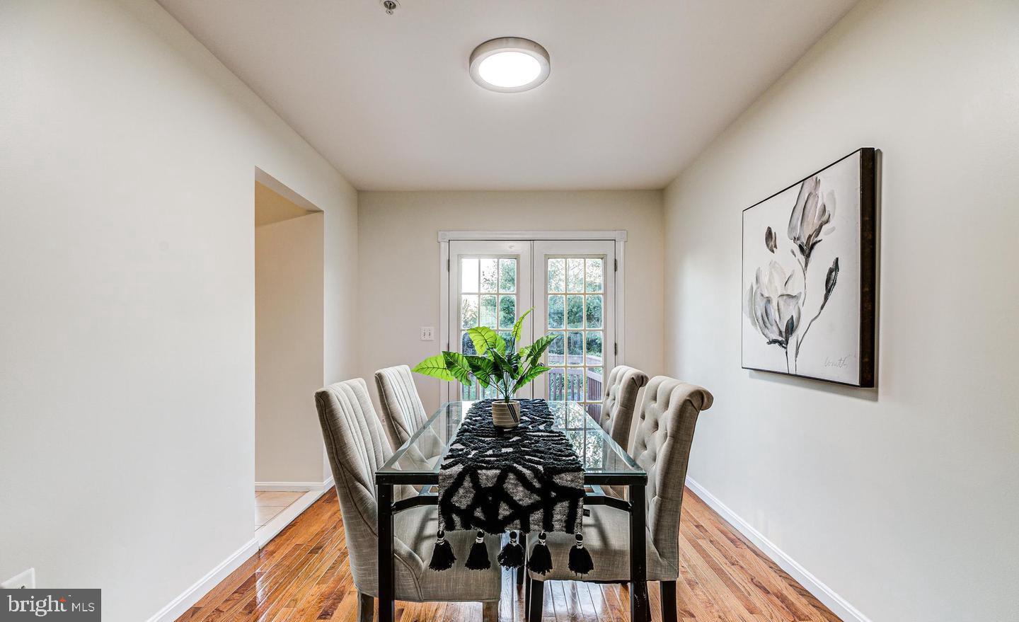 7520 Maury Road Baltimore, MD 21244 - Photo 8 of 29 a view of a dining room with furniture and chandelier