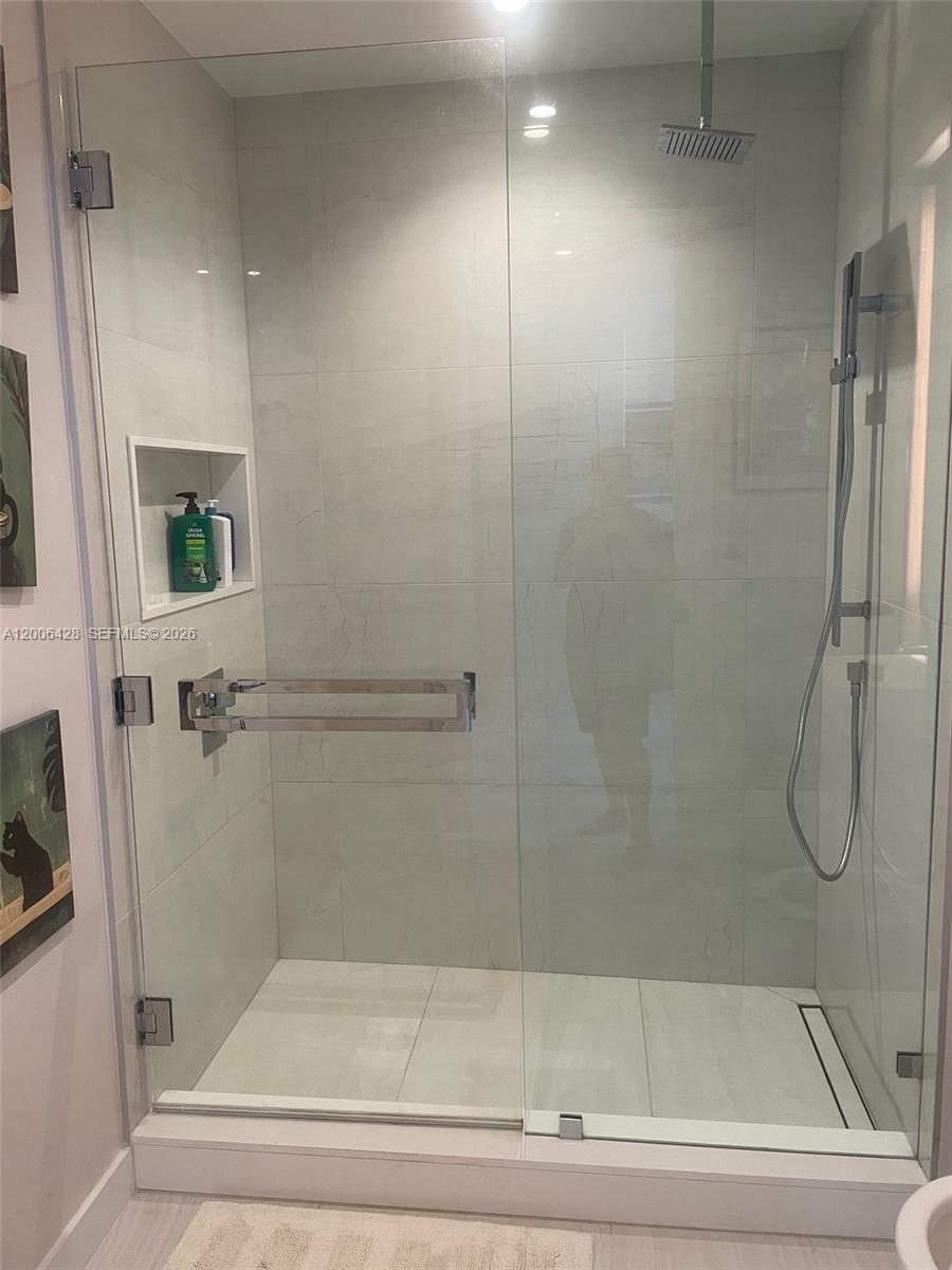 220 Southeast Mizner Boulevard, Unit 321 Boca Raton, FL 33432 - Photo 18 of 24 a bathroom with a shower