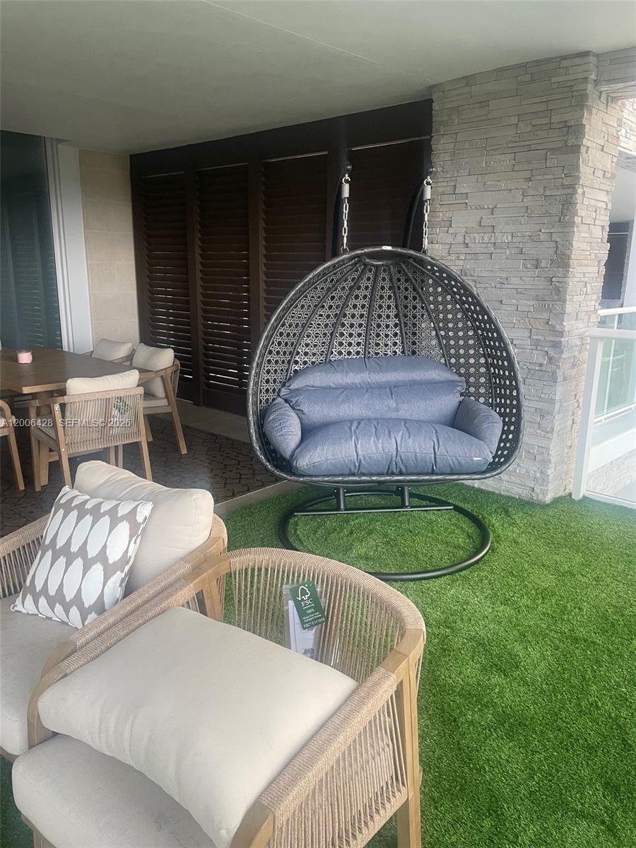 220 Southeast Mizner Boulevard, Unit 321 Boca Raton, FL 33432 - Photo 19 of 24 a view of balcony with furniture